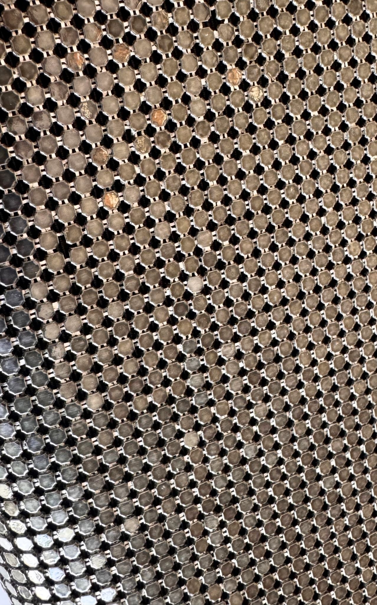 BCBG Max Azria gunmetal metal mesh clutch with leather whipstitch trim and tassel