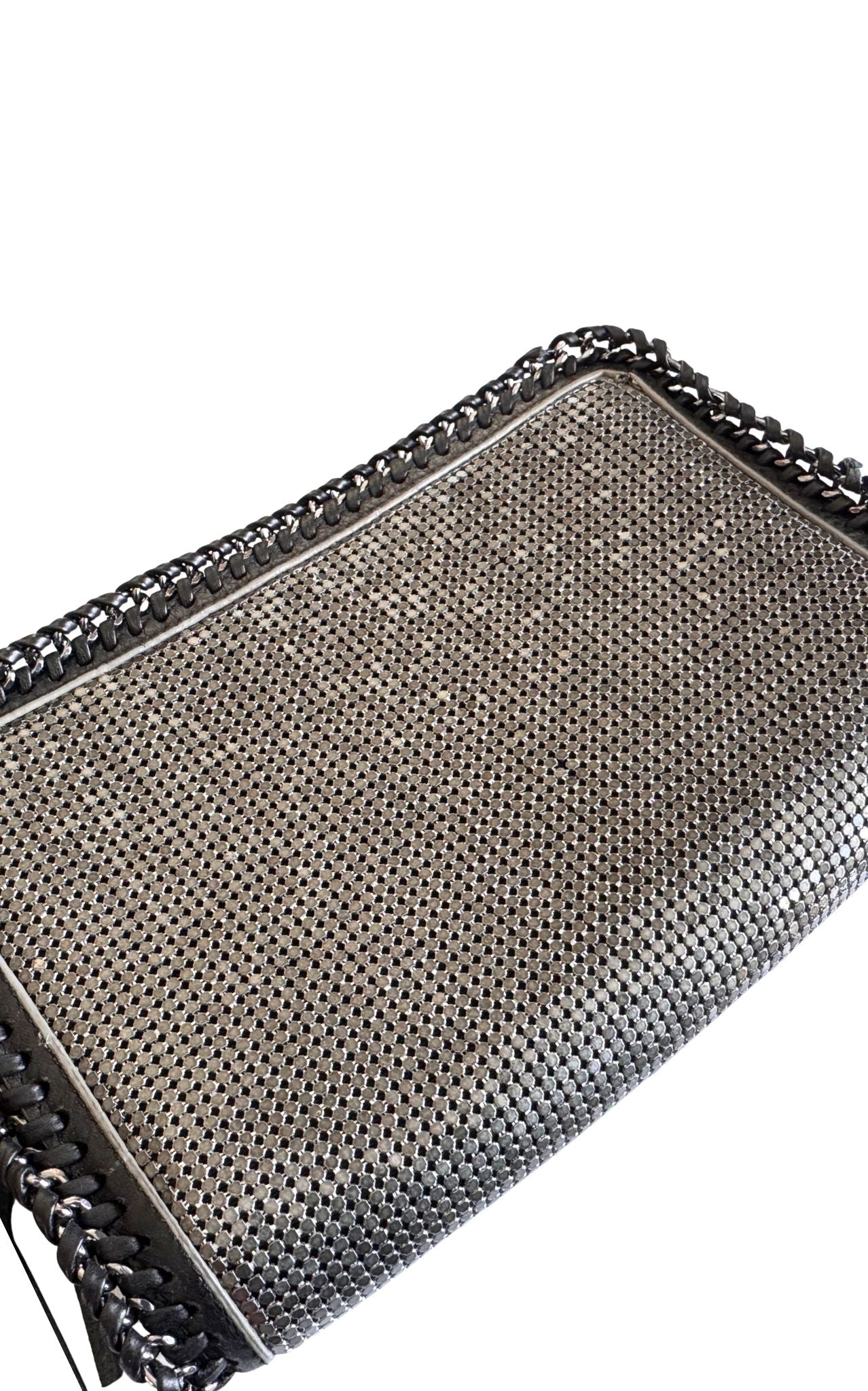 BCBG Max Azria gunmetal metal mesh clutch with leather whipstitch trim and tassel