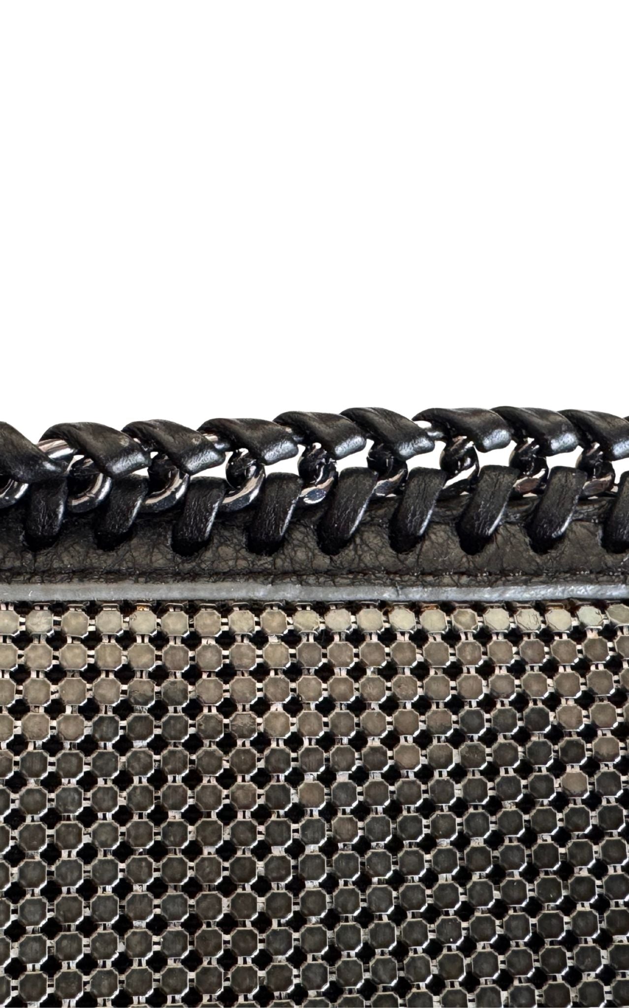 BCBG Max Azria gunmetal metal mesh clutch with leather whipstitch trim and tassel