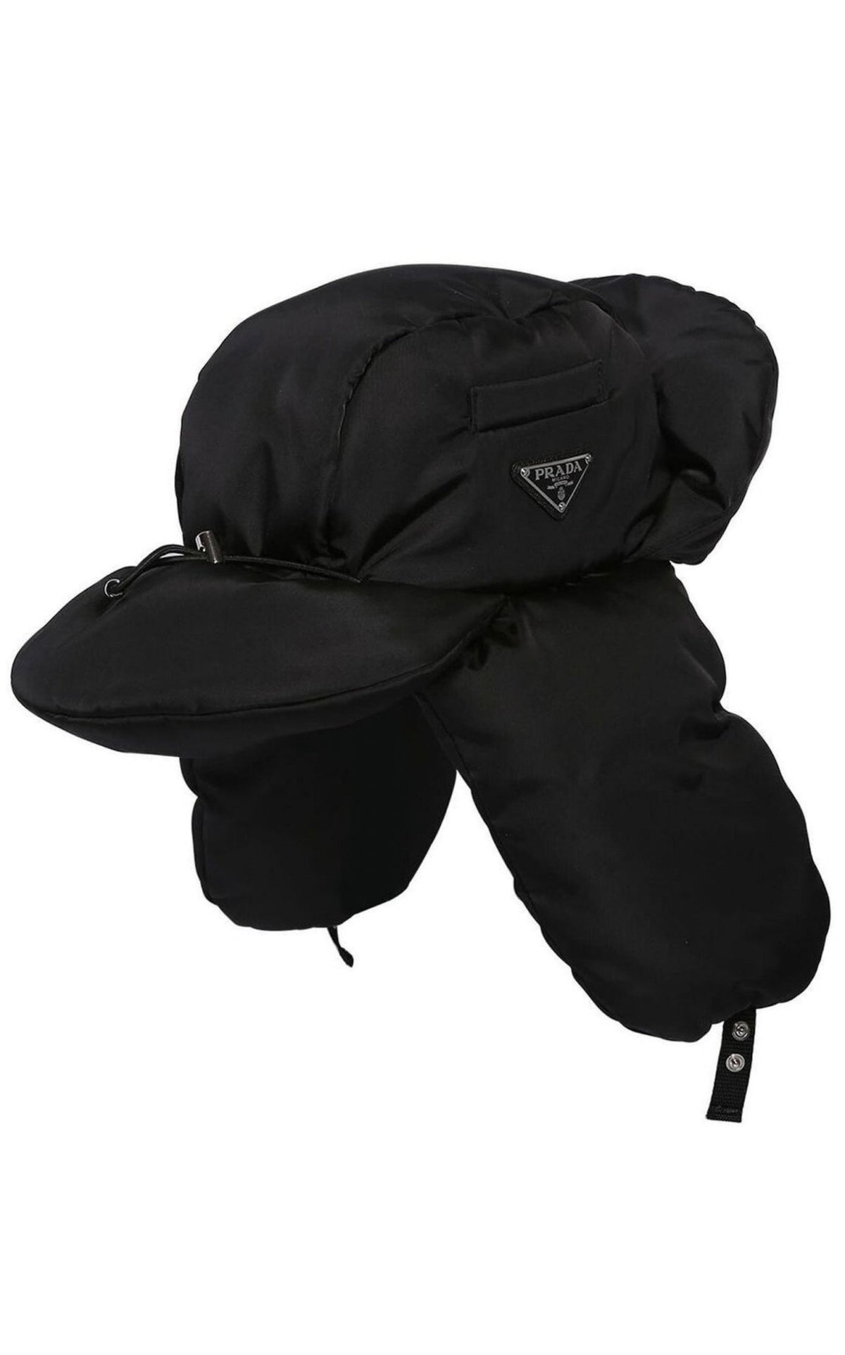 A black Prada winter trapper hat with ear flaps and chin cord, featuring a small triangular Prada logo on the side, set against a plain white background.