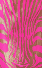 A close-up of a fabric pattern featuring bright hot pink and metallic gold vertical zebra-like stripes.