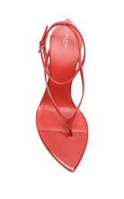 Alaia bright red patent leather thong sandal with a pointed toe and an ankle strap, shown from a top-down view on a white background. The brand name 'ALIA' is printed on the insole.