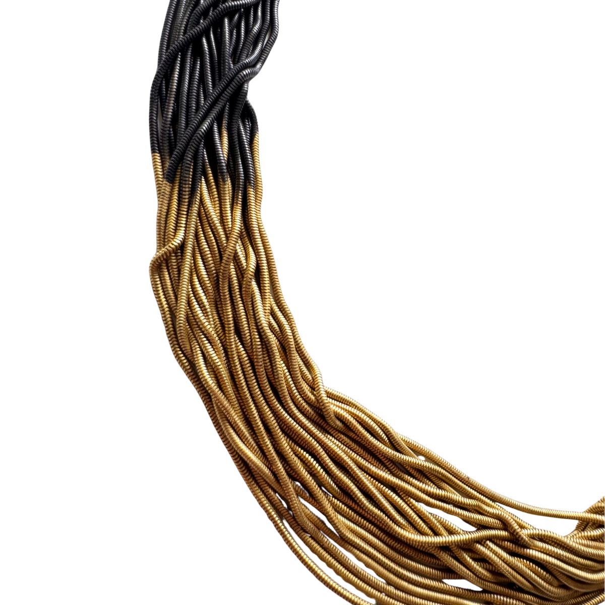 BCBGMAXAZRIA two-tone layered chain statement necklace in gold and gunmetal finishes