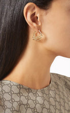 Gucci script logo crystal gold tone hoop earrings