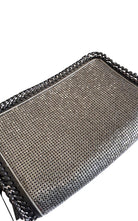 BCBG Max Azria gunmetal metal mesh clutch with leather whipstitch trim and tassel