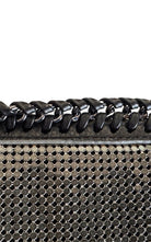 BCBG Max Azria gunmetal metal mesh clutch with leather whipstitch trim and tassel