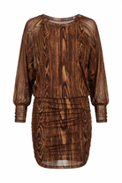 A brown sheer mesh dress with a dark wood grain print, featuring long balloon sleeves and a ruched gathered skirt, shown against a plain white background.