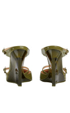 Gucci’s Christy 110 wedge mules in green 