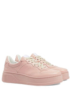 Gucci GG Embossed - logo Leather Sneakers - Runway Catalog