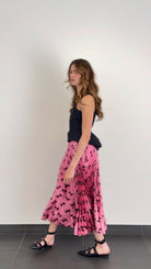 Gucci – Plisseerock mit schillernder Schleife aus Lurex – Laufsteg-Katalog