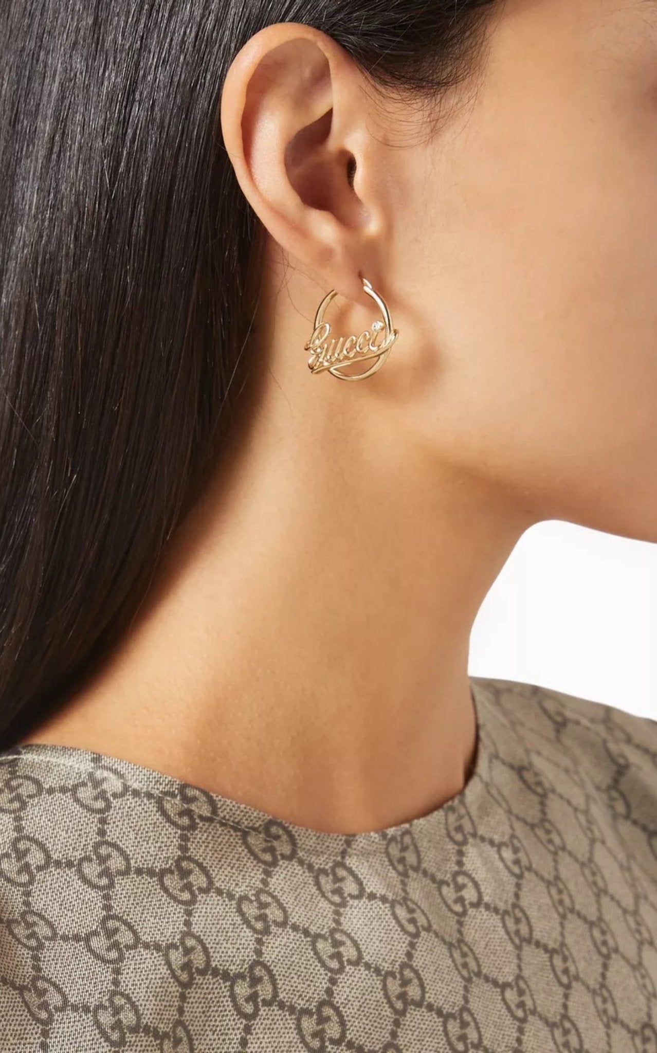 Gucci script logo crystal gold tone hoop earrings