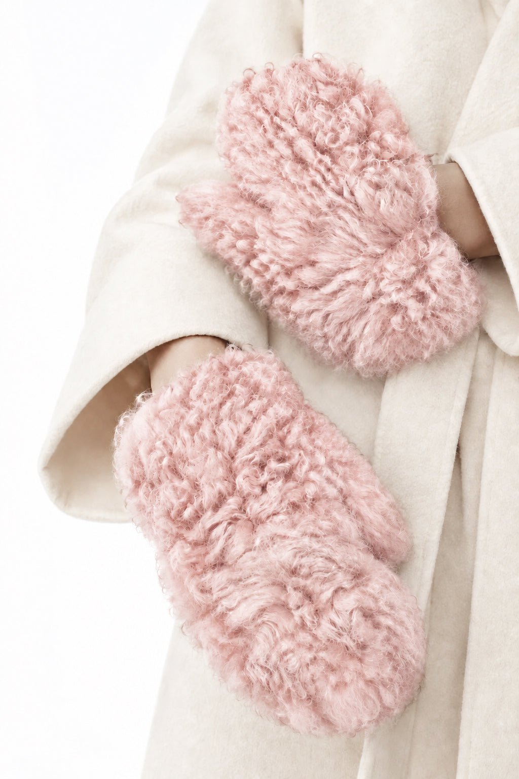 A pair of Miu Miu - fluffy, curly faux-shearling mittens in a dusty rose pink color.