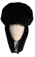 A black faux fur ushanka hat with ear flaps, displayed on a white mannequin head against a white background.