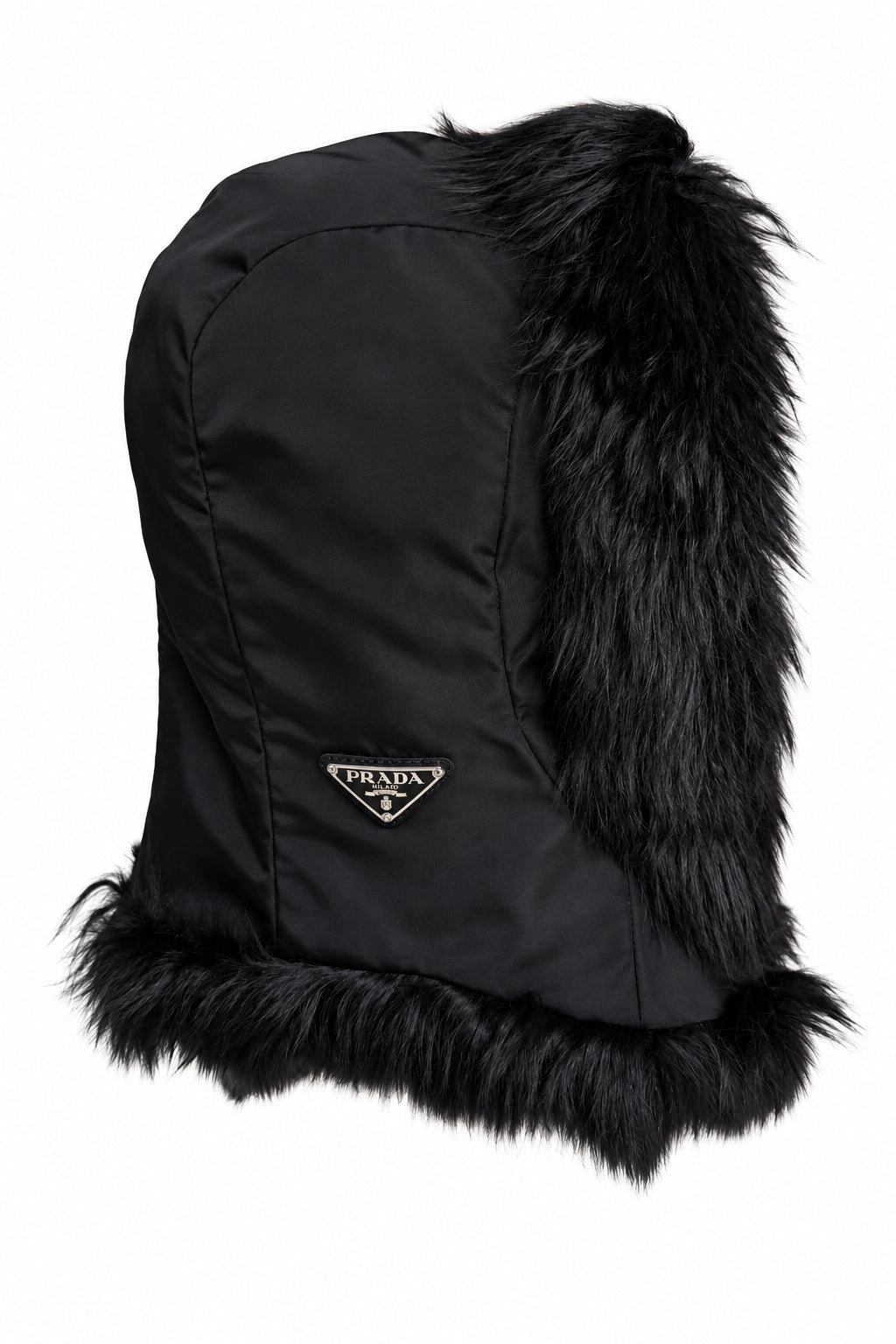 A black Prada fur-trimmed hat featuring a black nylon body, a gold-tone triangular Prada logo on the front, and a fluffy black fur trim at the top and bottom, shown against a plain white background.