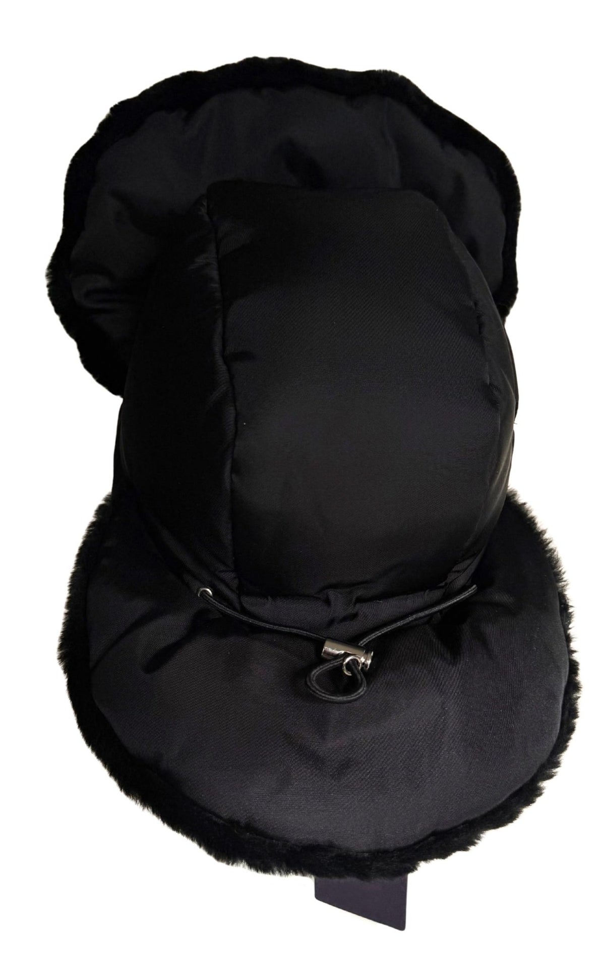 A black winter trapper hat with faux fur trim, featuring a padded crown, ear flaps, and chin strap with a silver metal snap closure, shown against a plain white background.