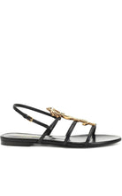Saint Laurent Metal Monogram Cassandra Sandals - Runway Catalog